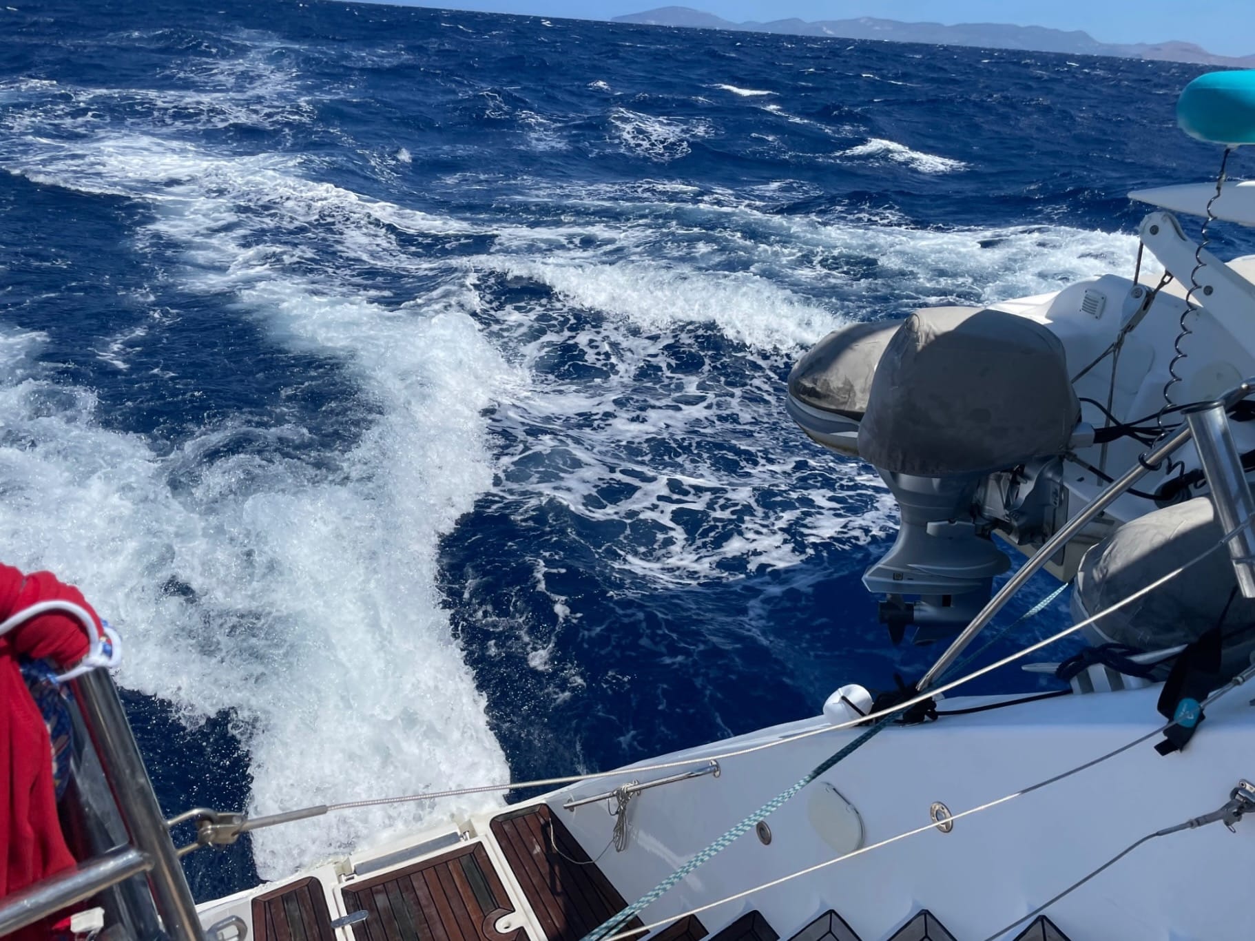 Yacht sailing offshore in open ocean during a long-distance passage